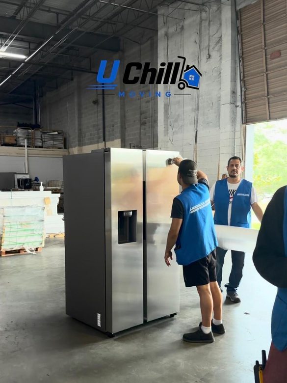 Refrigerator being shrink-wrapped for transport